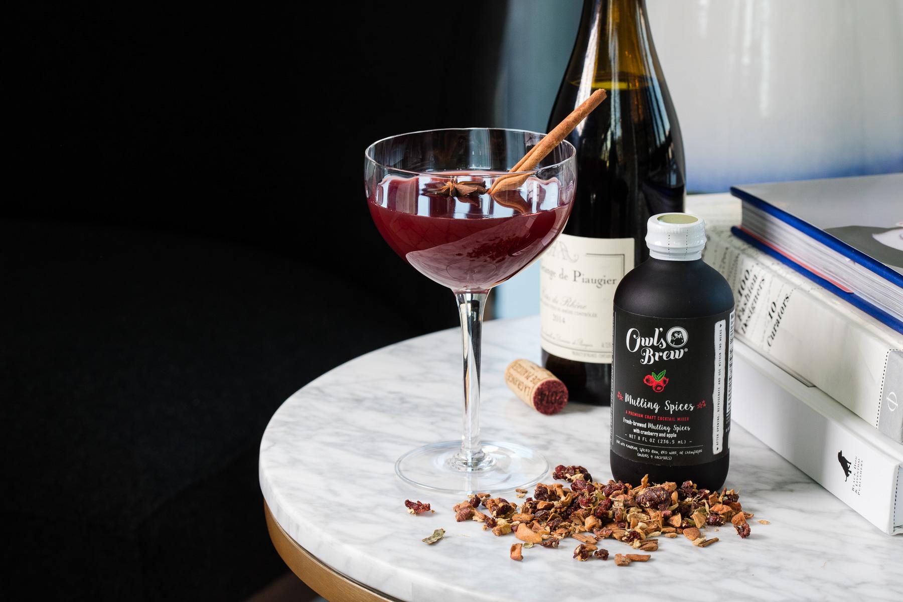 Autumn spiced cocktail with warm seasonal botanicals and moody editorial lighting - fall spirits campaign photography