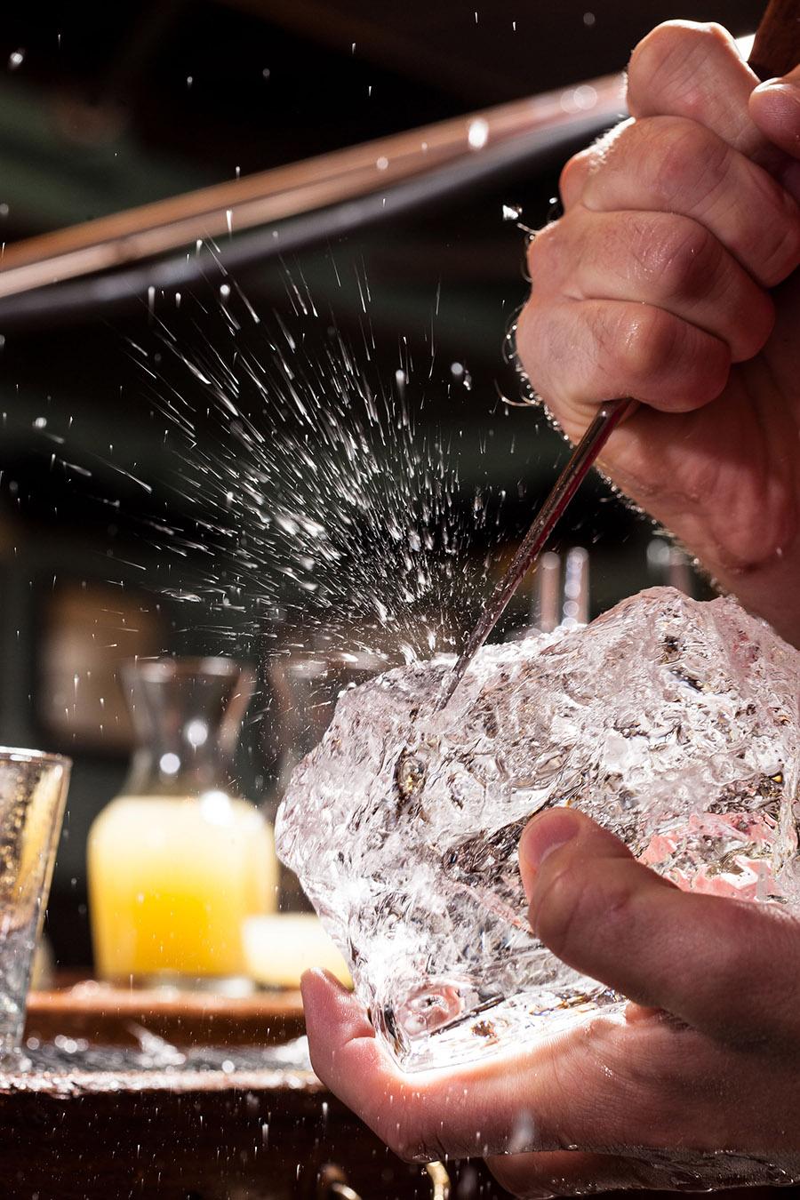 Bartender mixing a cocktail behind a New York bar