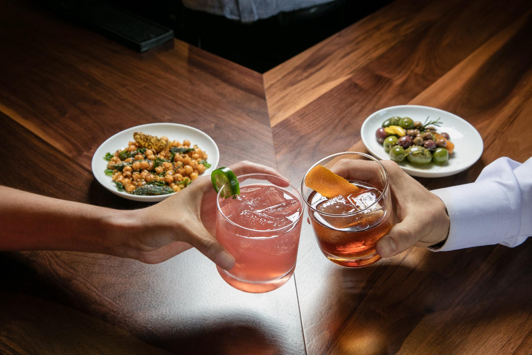 Festive winter cocktail with sparkling garnish and celebratory holiday staging - seasonal beverage brand photography
