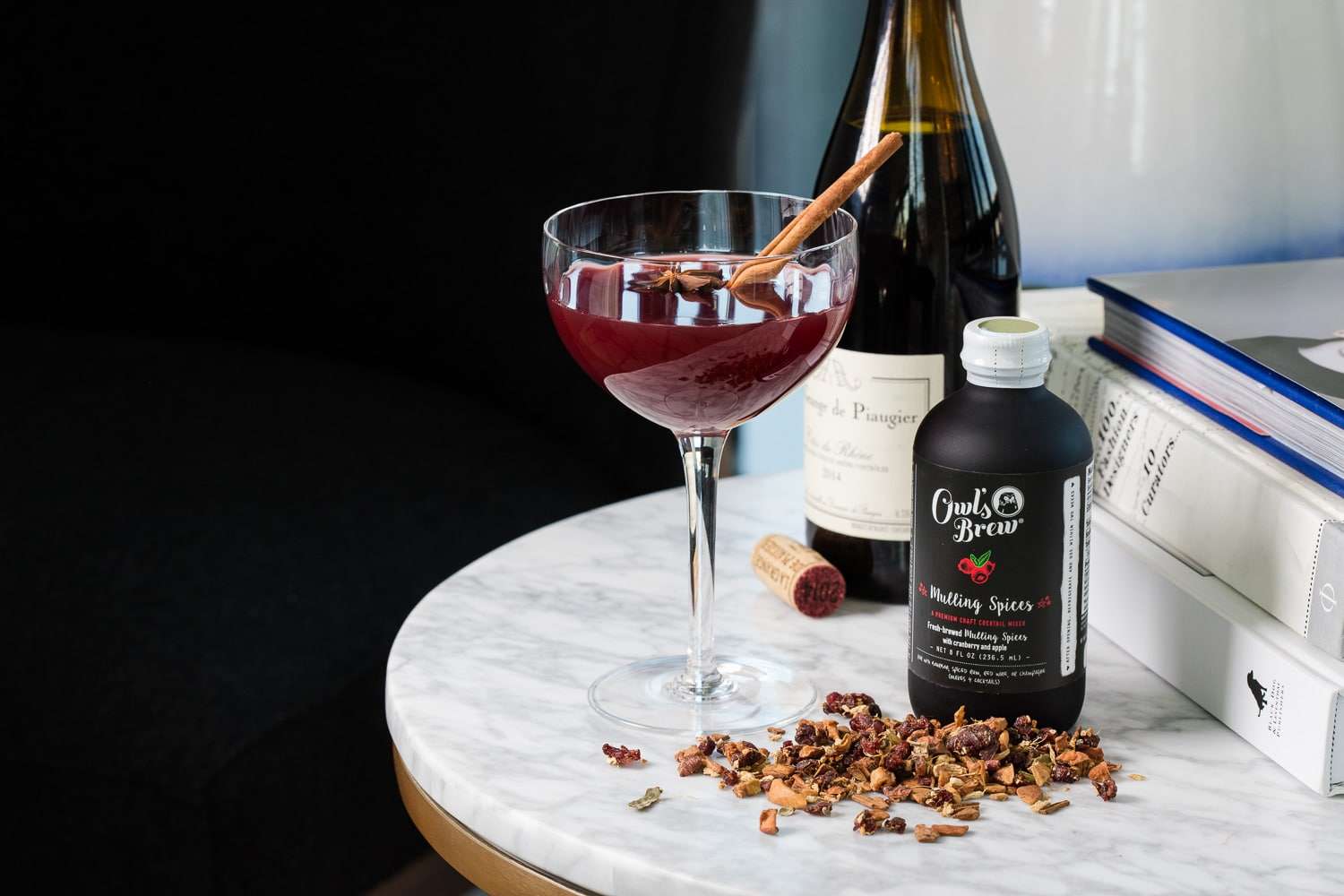 Spiced mulled wine with cinnamon sticks and star anise - seasonal holiday cocktail photography for spirits campaign