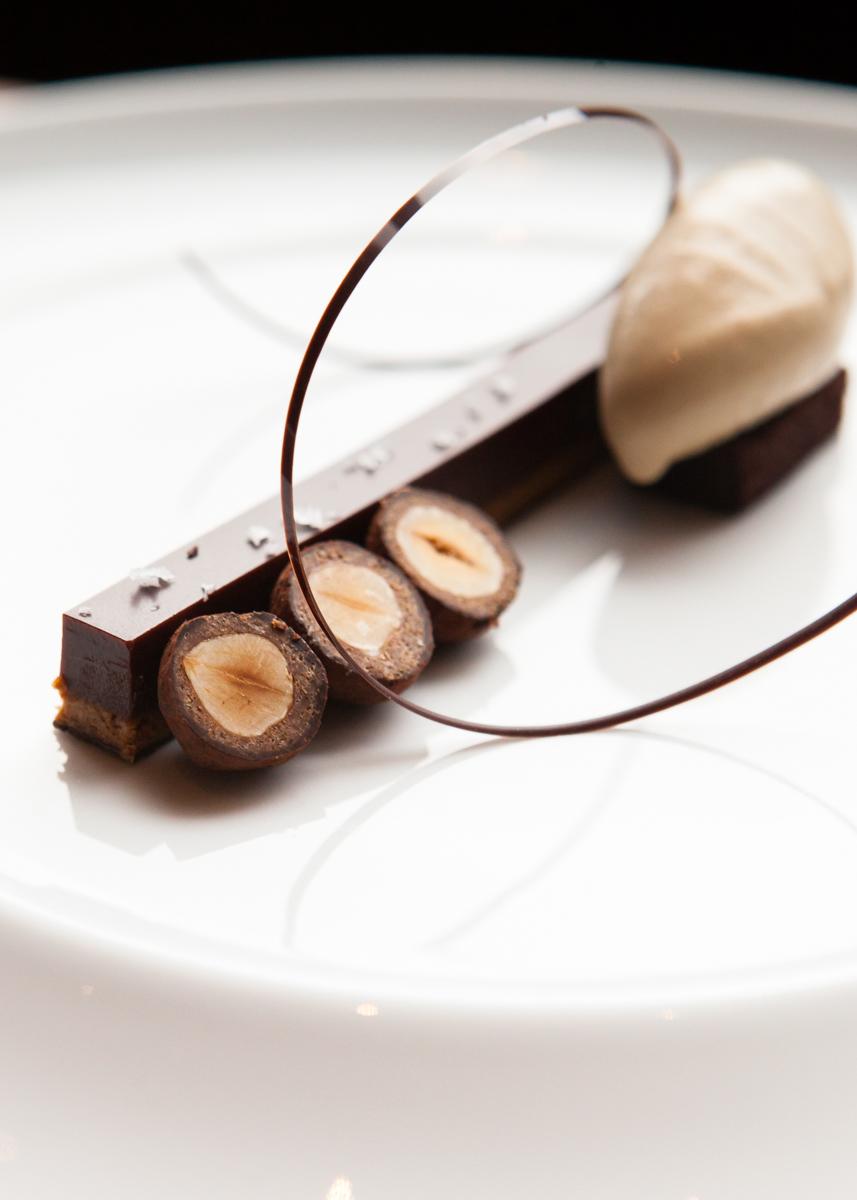 Chocolate hazelnut bar with a dark chocolate ring and ice cream quenelle at Per Se