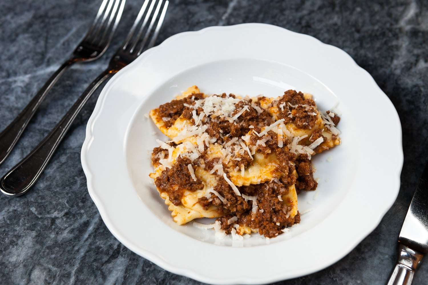 Beef bolognese over ravioli, New York restaurant food photography