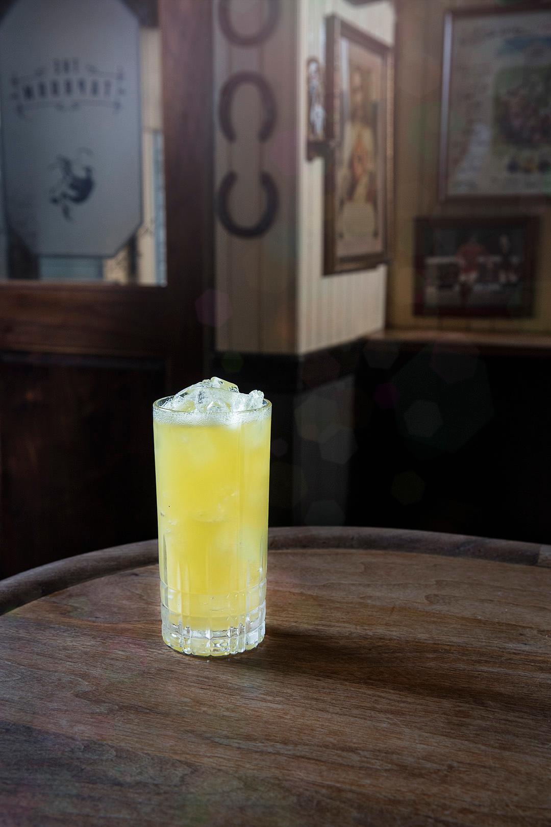 Tequila sunrise with layered colors and dramatic backlighting