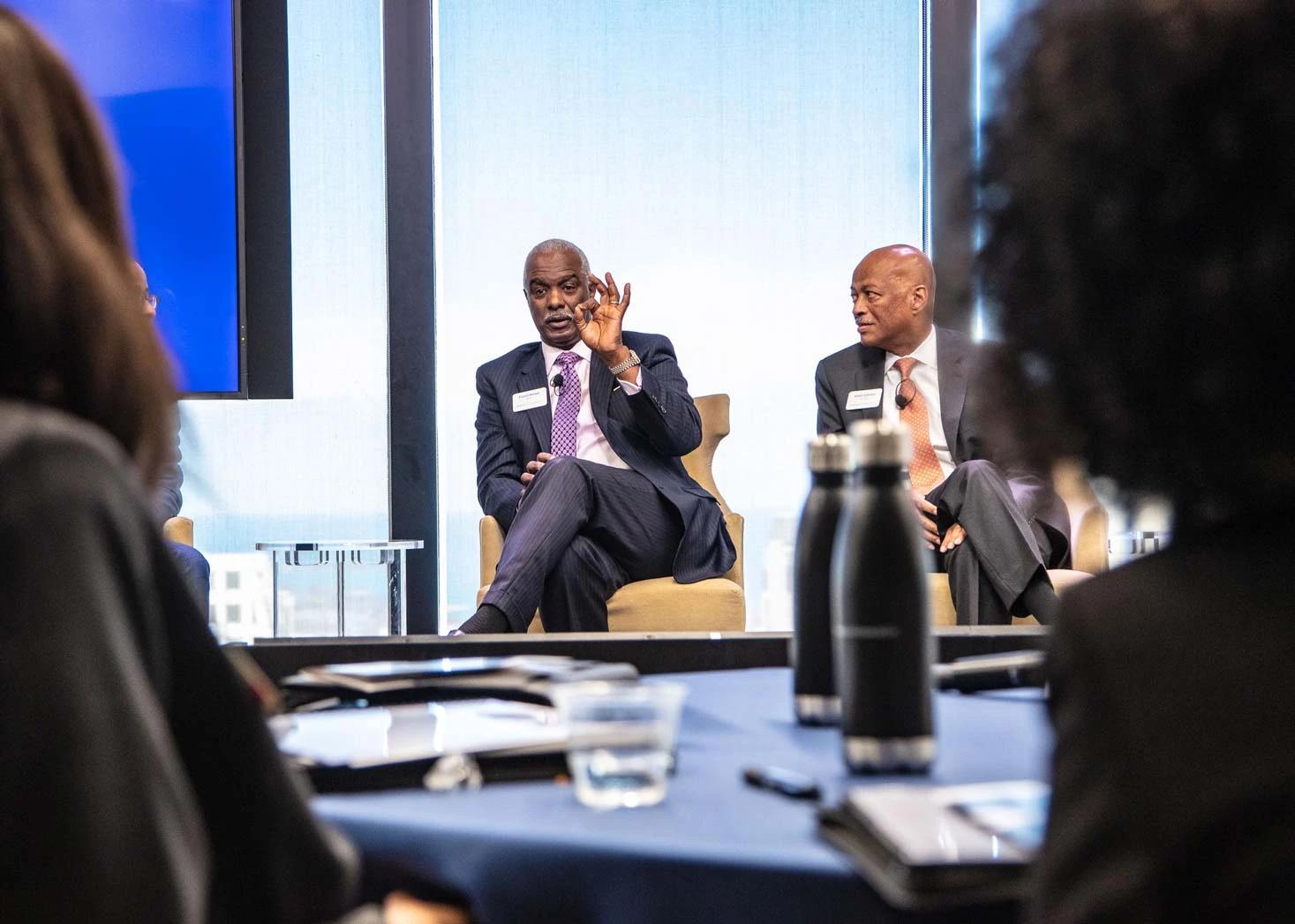 Panel discussion on stage at business forum