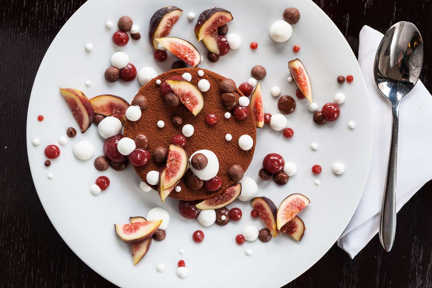 Rich chocolate cake with fresh fig topping and texture details