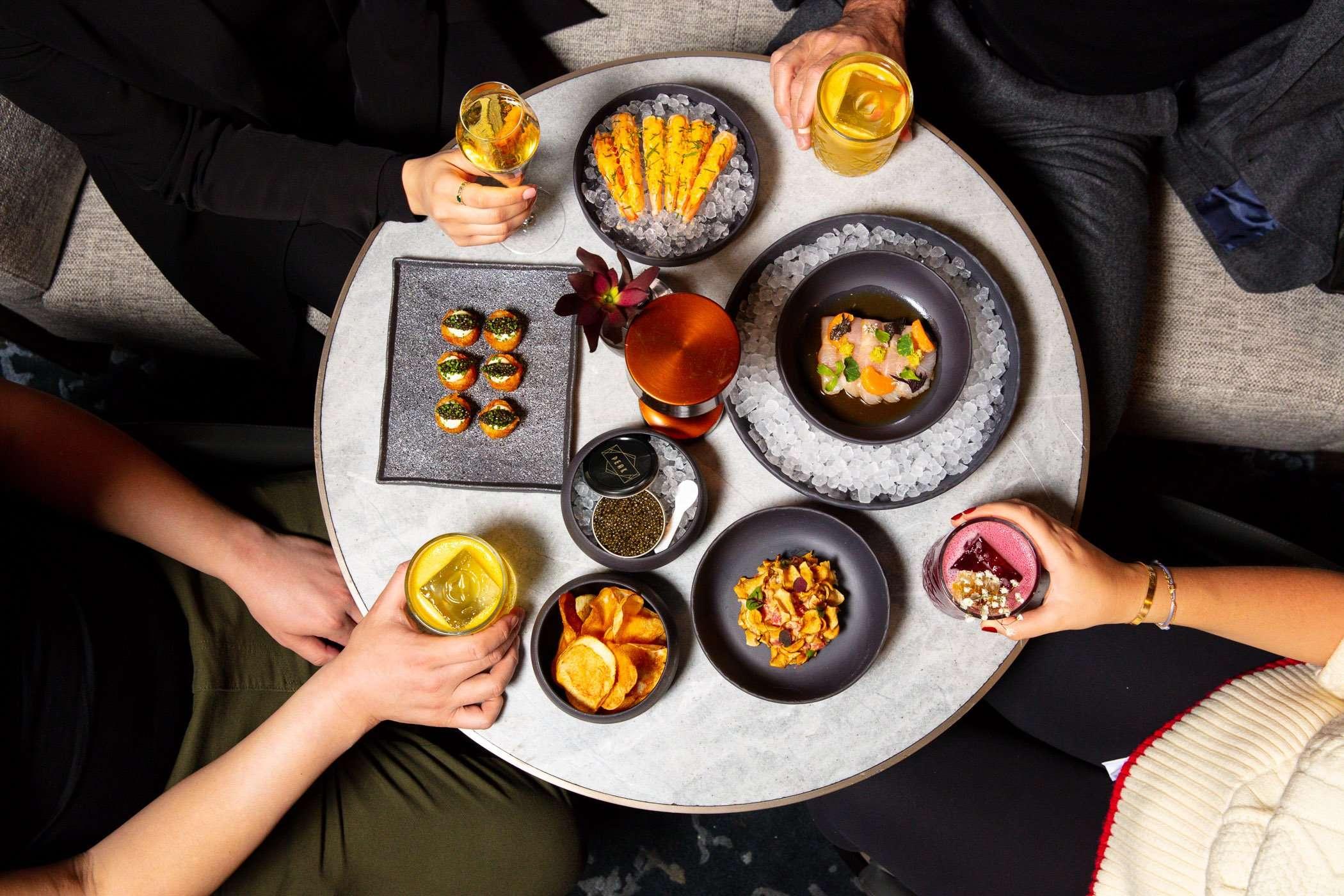 Peak Bar NYC modern interior with panoramic city skyline views, capturing luxury hospitality atmosphere