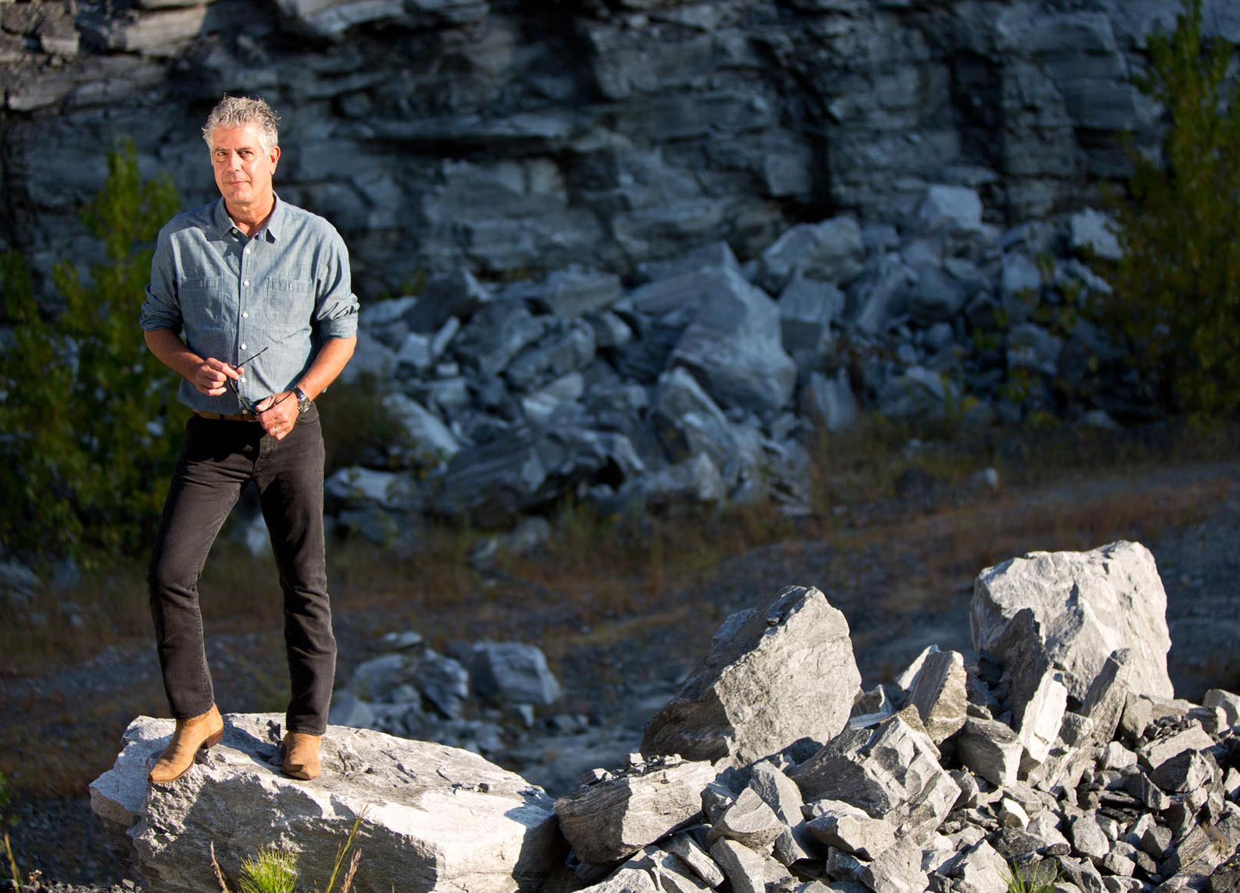 Portrait of Anthony Bourdain with dramatic lighting