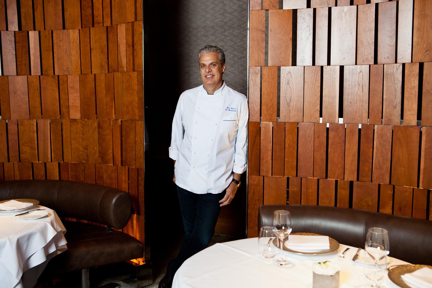 Mixologist shaking cocktail at bar