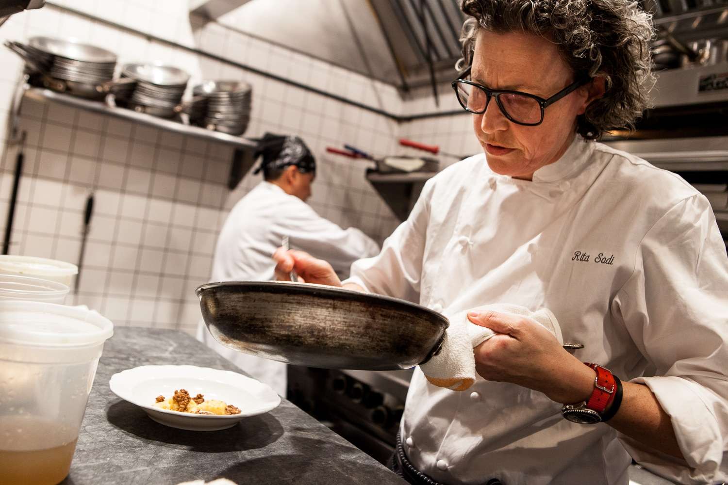 Chef Rita Sodi cooking pasta in restaurant kitchen