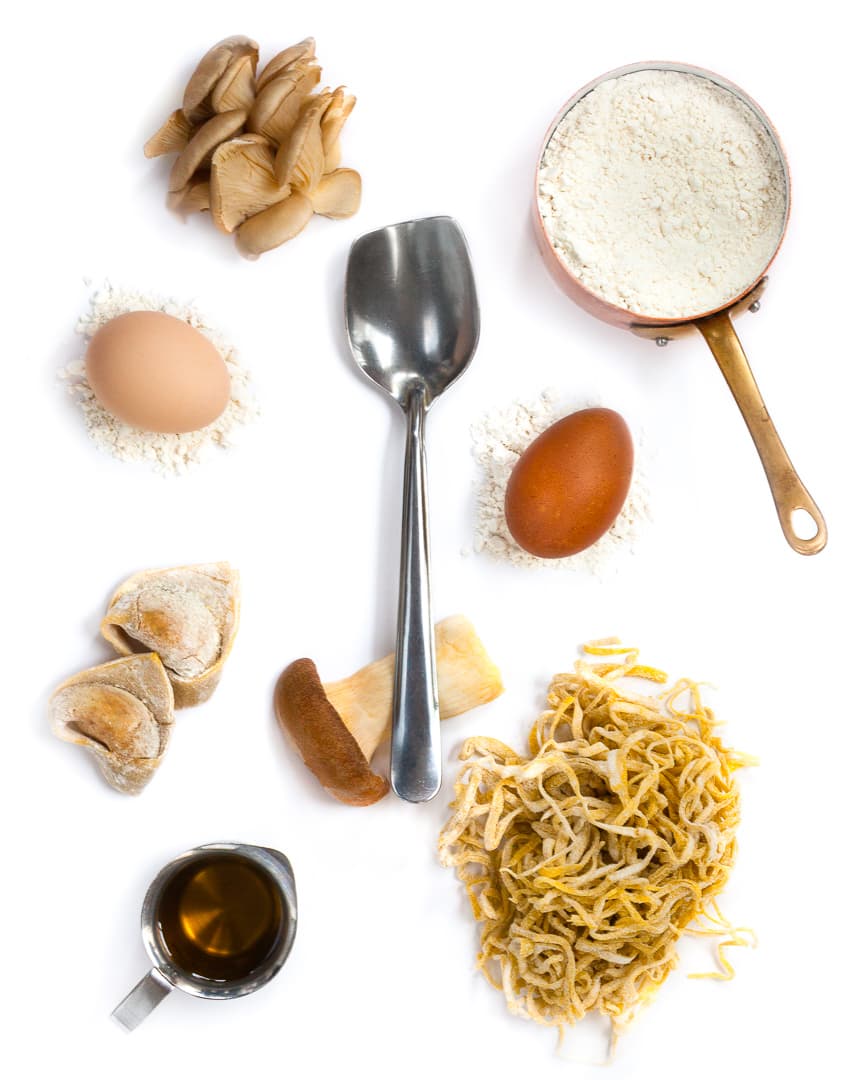 Spoonful portrait of Chef Chris Hall titled Pasta Lover, featuring flour, eggs, and handmade tortelloni with a shovel-shaped transformer spoon.