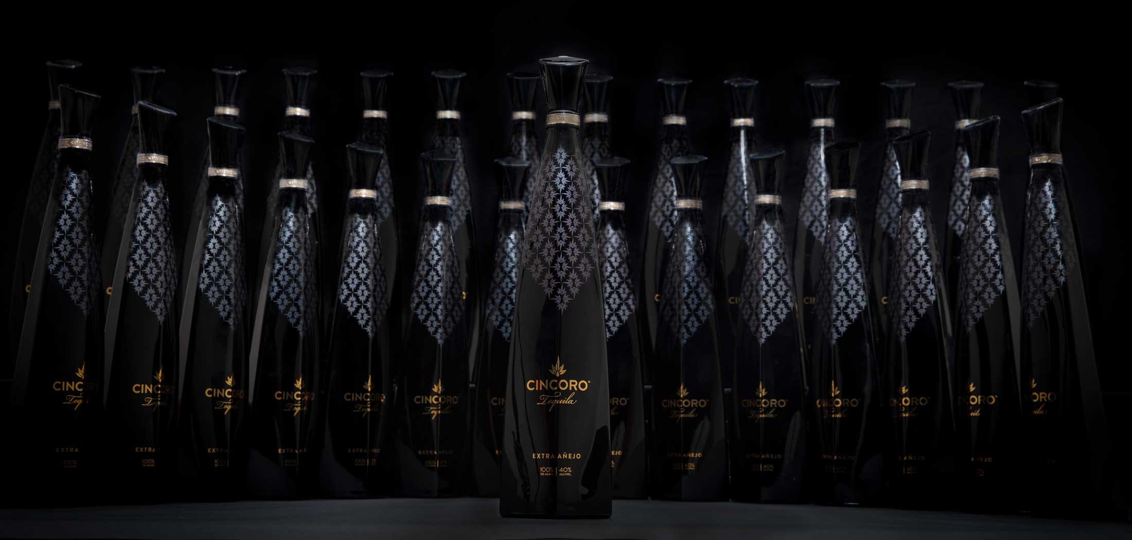 Cincoro Tequila bottle lineup featuring Michael Jordan's tequila brand for Lakers partnership