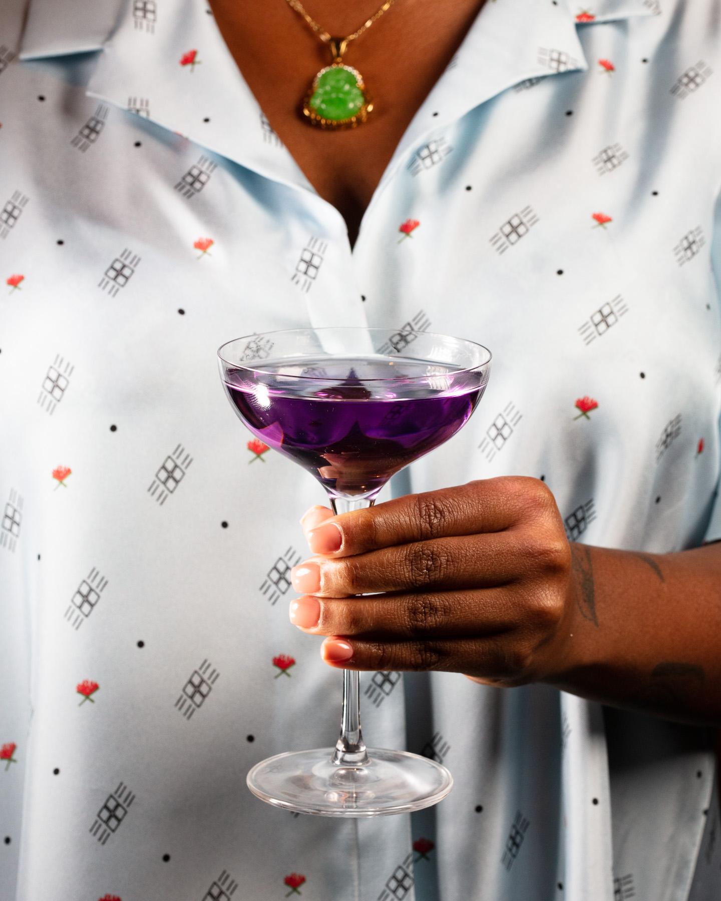 Fashion-forward lifestyle drinking shot with model