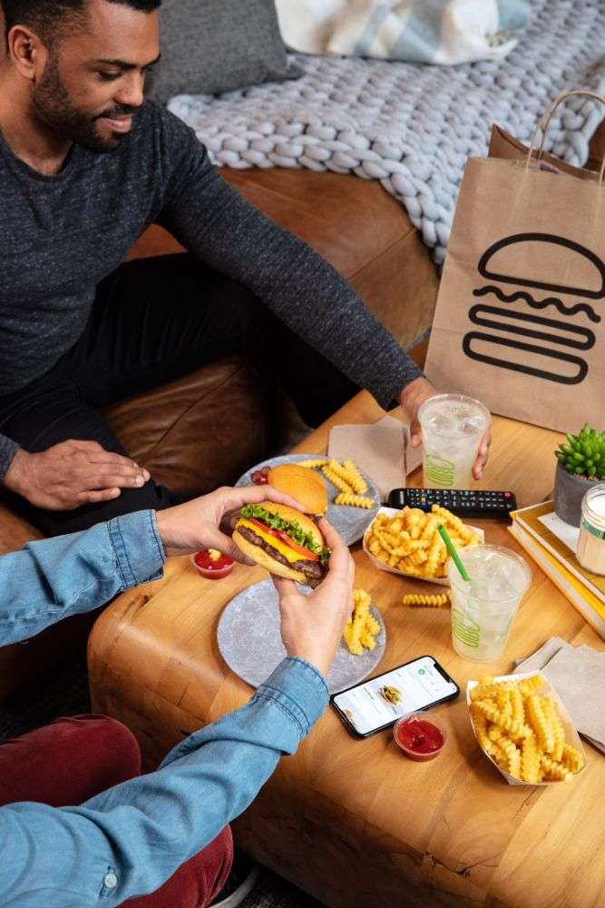 Shake Shack signature burger with melted cheese and crispy fries
